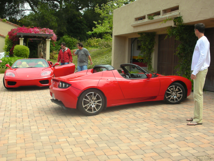 Admiring the Ferrari and the Tesla